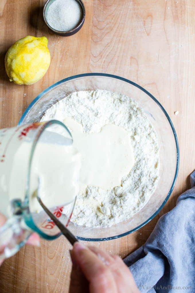 Adding a mix of cream and sourdough into the flour.