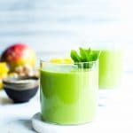 Mango Green Smoothie in a glass ready for sharing.