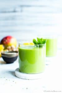 Mango Green Smoothie in a glass ready for sharing.