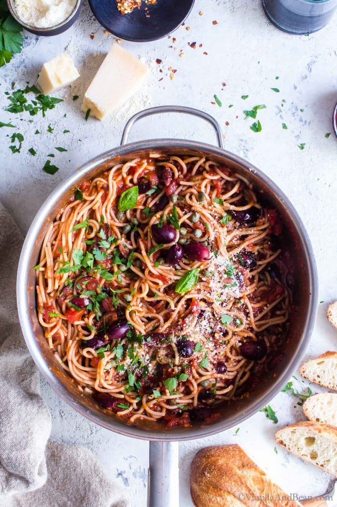 Vegan Spaghetti Puttanesca in a skillet ready to eat.