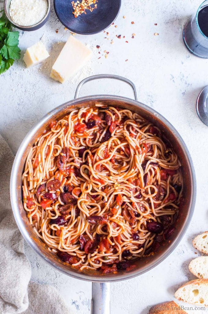 Vegan Spaghetti Puttanesca in a skillet ready to eat.