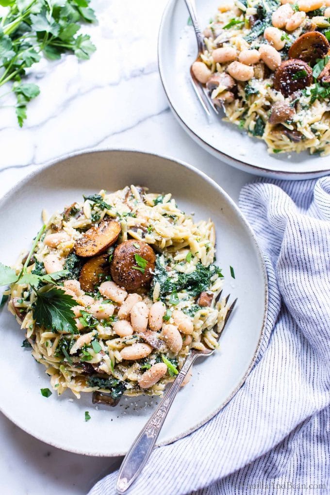Creamy White Bean and Parmesan Mushroom Orzo on a plate garnished with Parsley
