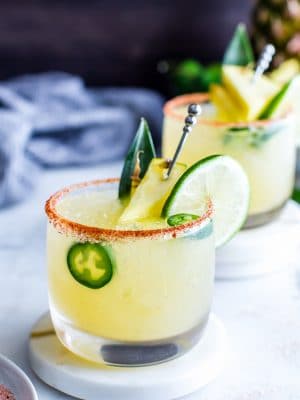 Spicy Margarita close up garnished with lime and jalapeno.