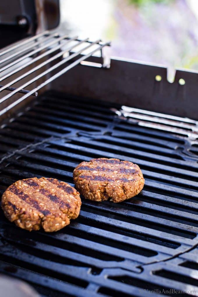 Chickpea burger patties on a grill.