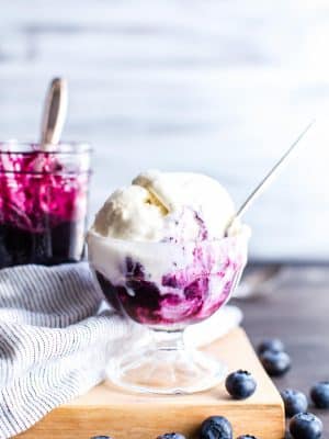 Blueberry compote swirled into ice cream.