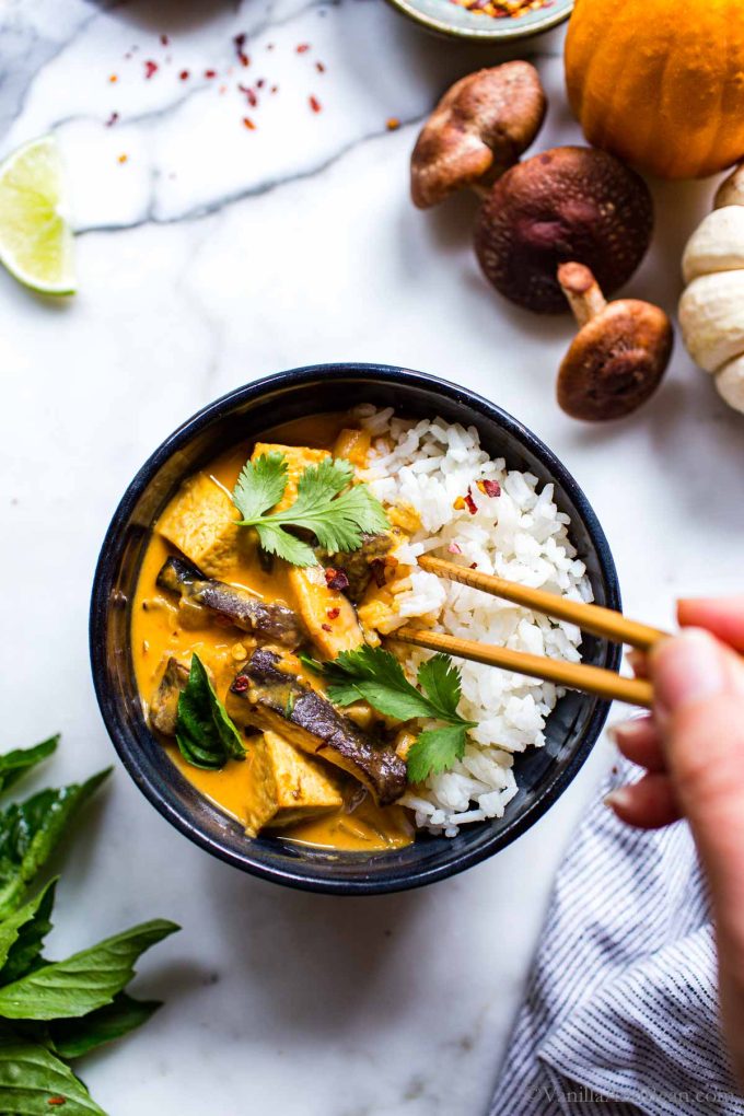 Pumpkin Curry Recipe Thai shared with rice and with chopsticks dipping into the bowl.