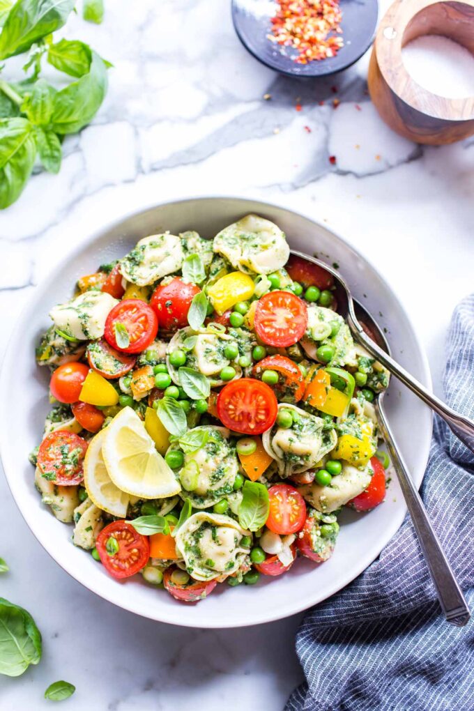 Cheese tortellini pasta salad in a bowl ready to share. 