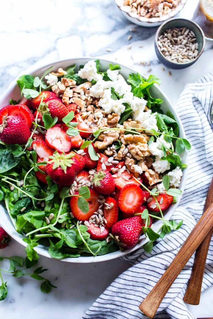 Goat Cheese Strawberry Salad in a bowl ready for sharing.