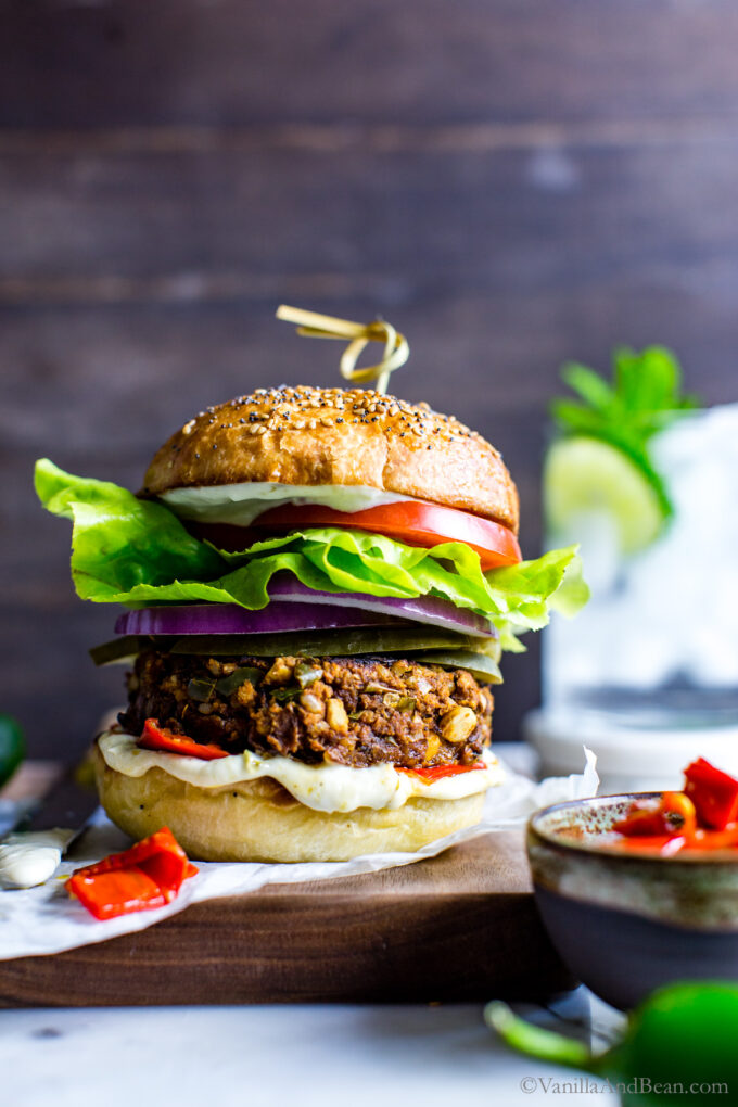 Sourdough Burger Buns on a chickpea veggie burger piled high with fixings.