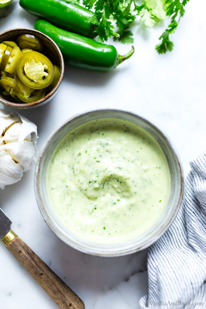 Jalapeno Aioli in a dish with a knife on the side.
