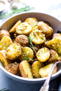 Roasted Garlic and Rosemary Potatoes in a bowl ready for serving.