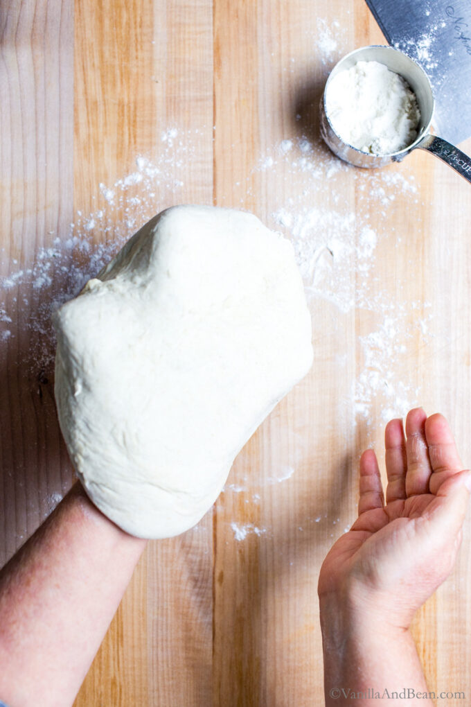 Gently shaping the sourdough discard pizza dough.