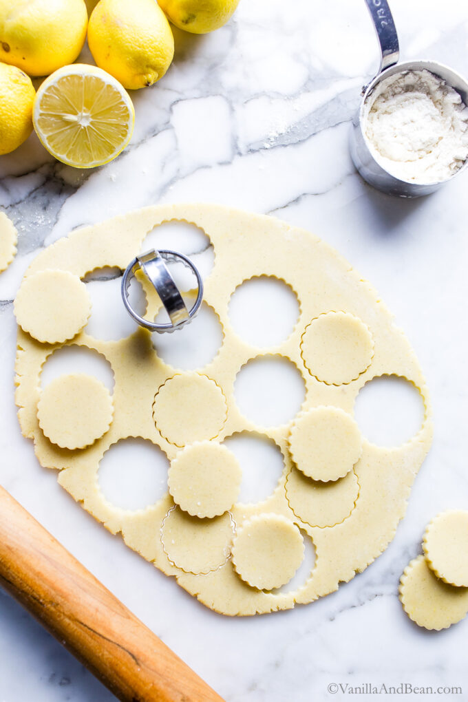 Lemon cutout cookie dough on a table.