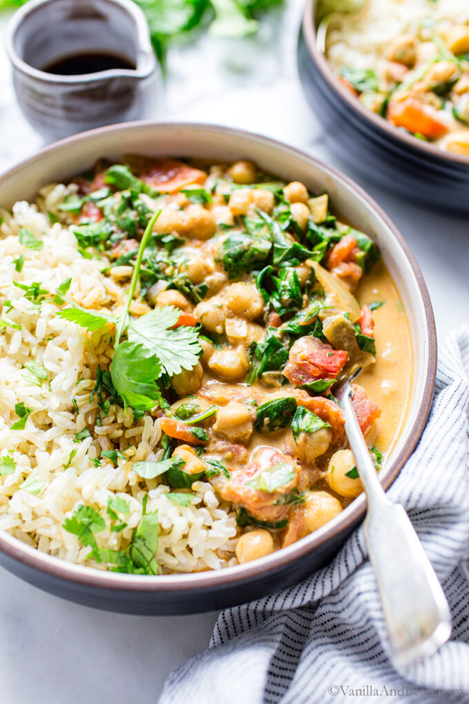 Spinach Chickpea Curry with Coconut Milk in a bowl with basmati rice.