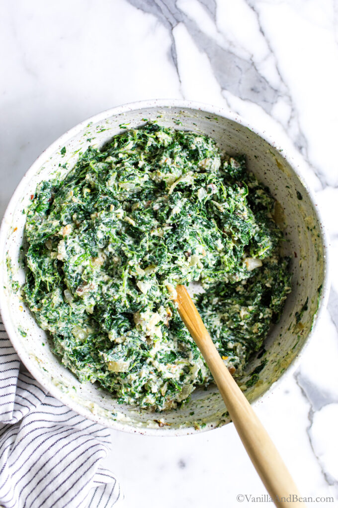 Spinach and cheese mixture in a bowl.