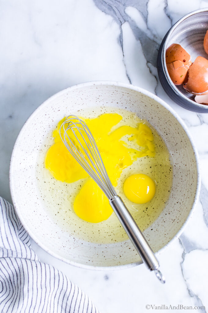 Whisking eggs in a bowl.