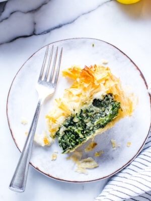 A cross section of Ricotta and Spinach Pie on plate.