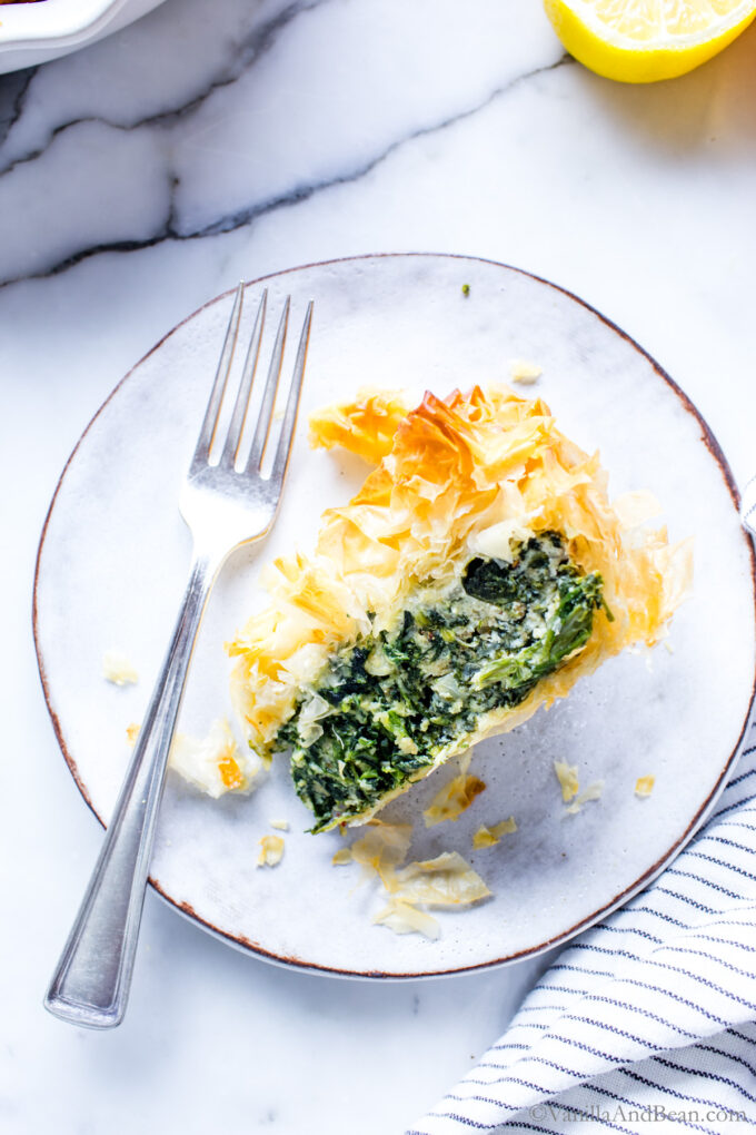 A cross section of Ricotta and Spinach Pie on plate.