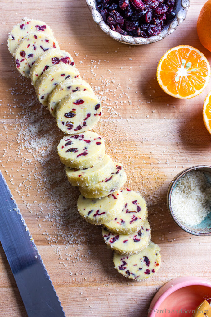 Sliced cranberry orange cookie dough.