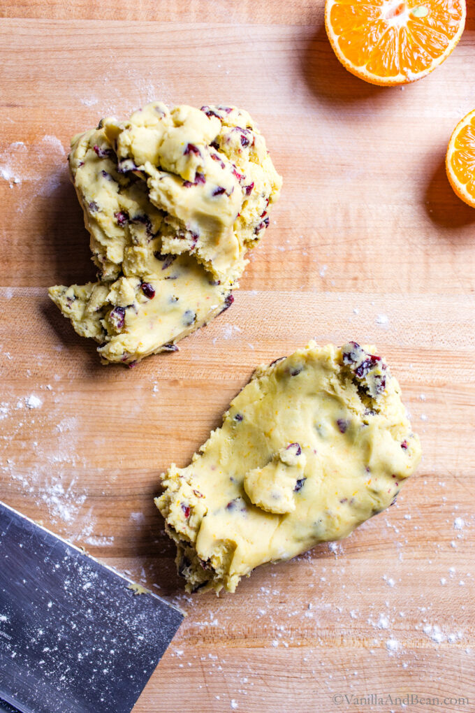 Divided cookie dough on a board.