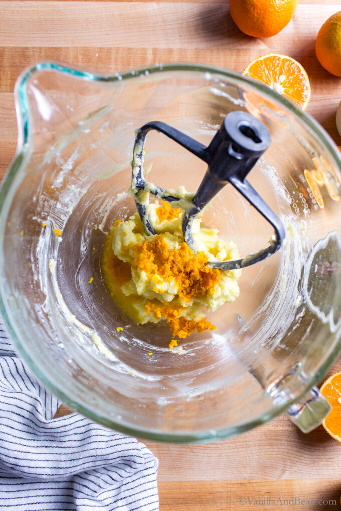 Orange zest and juice with butter mixture Mixed butter and sugar in a stand mixer bowl.