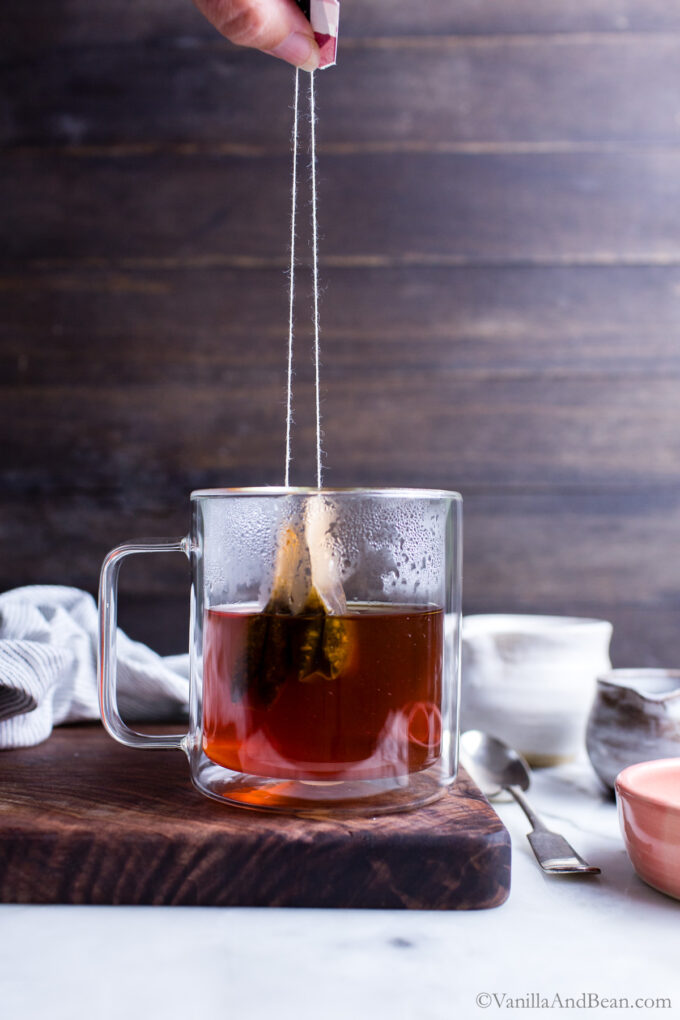 chai tea bags in a cup with hot water.
