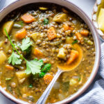 Bowl full of french lentil soup vegetarian style.