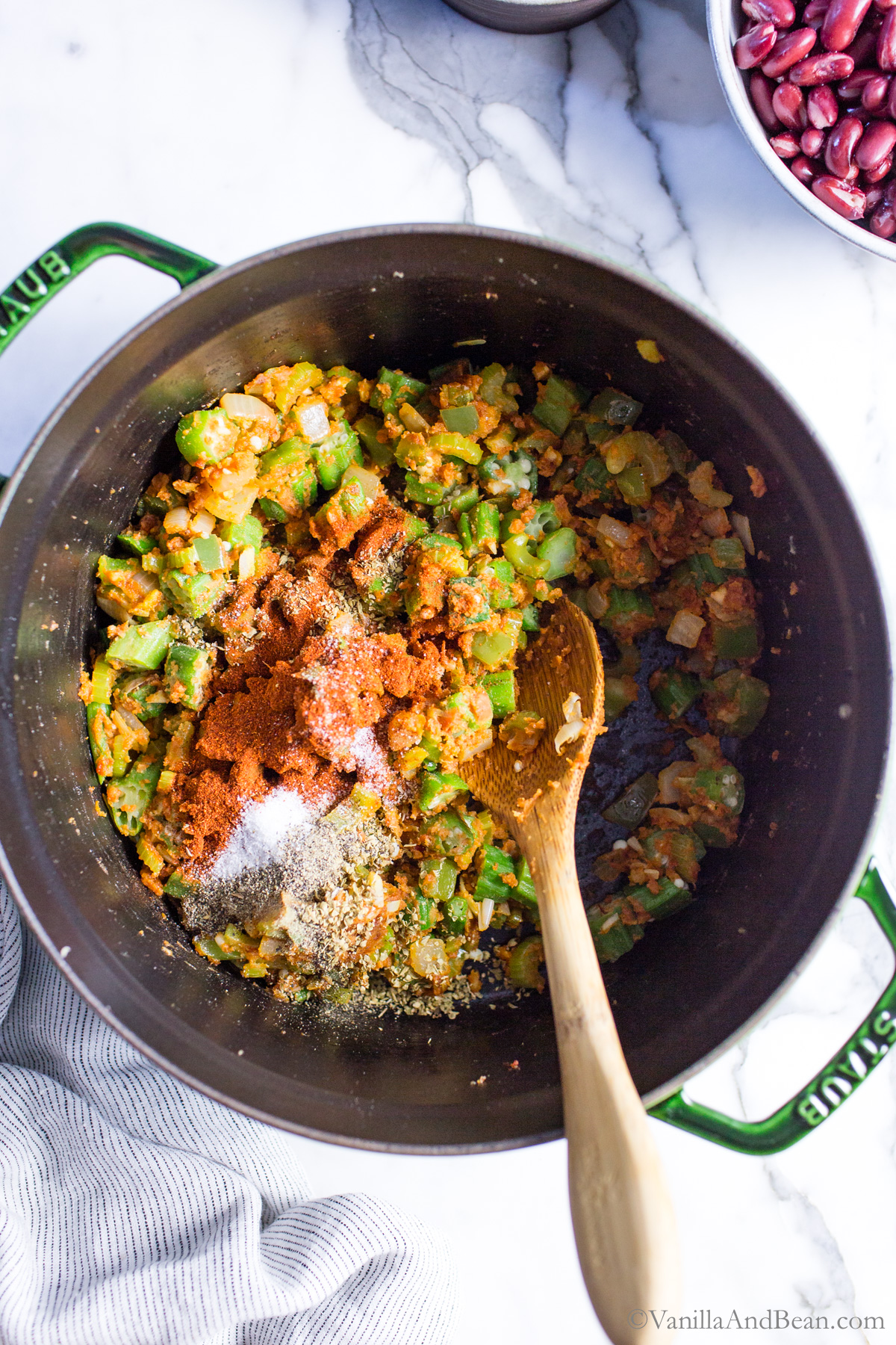 To the Dutch oven, seasonings and salt are added.