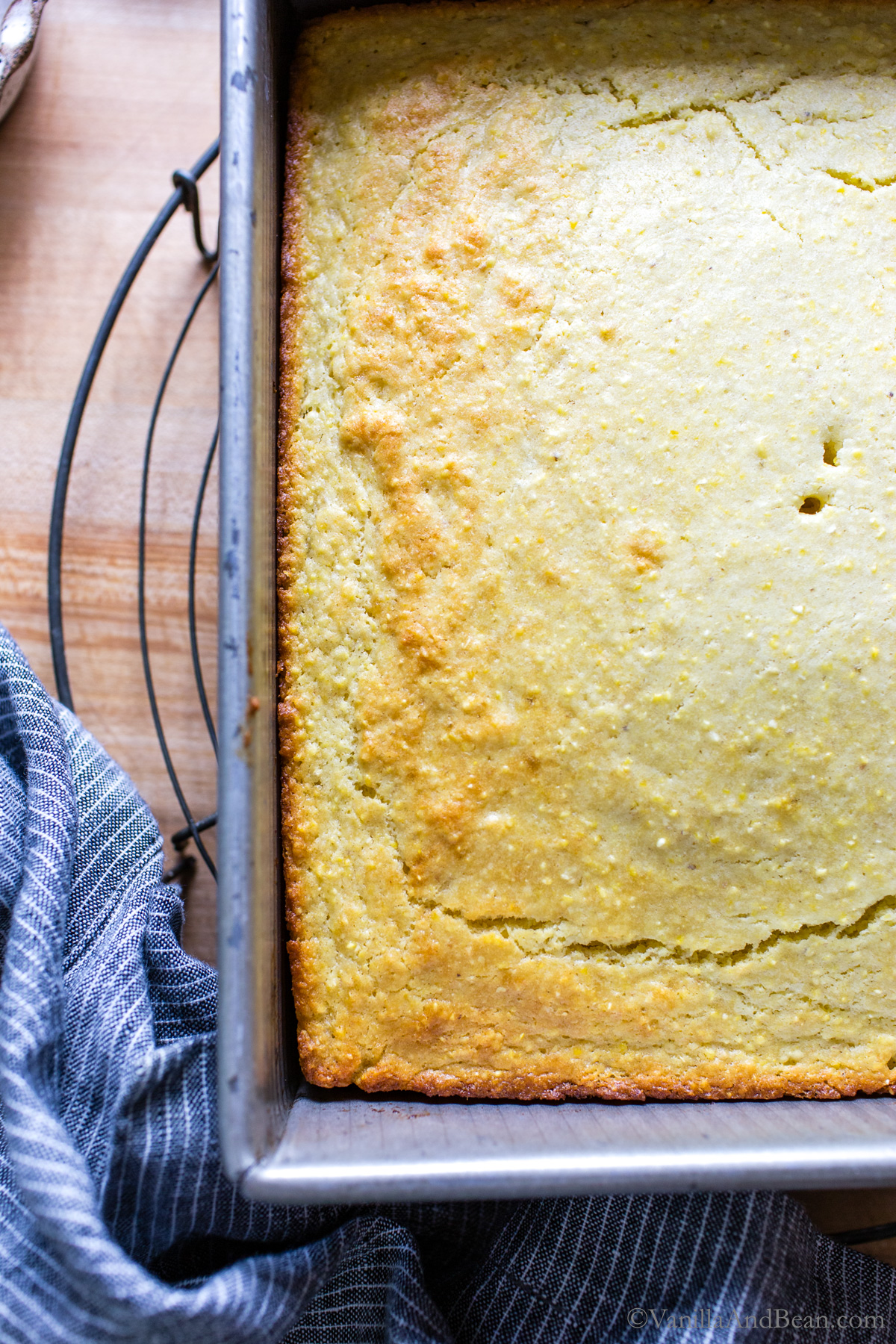 Baked sourdough cornbread in a 9x9 metal pan.