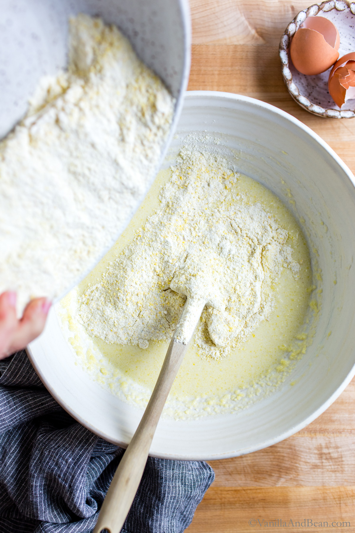 Adding cornbread dry ingredients to the wet ingredients.