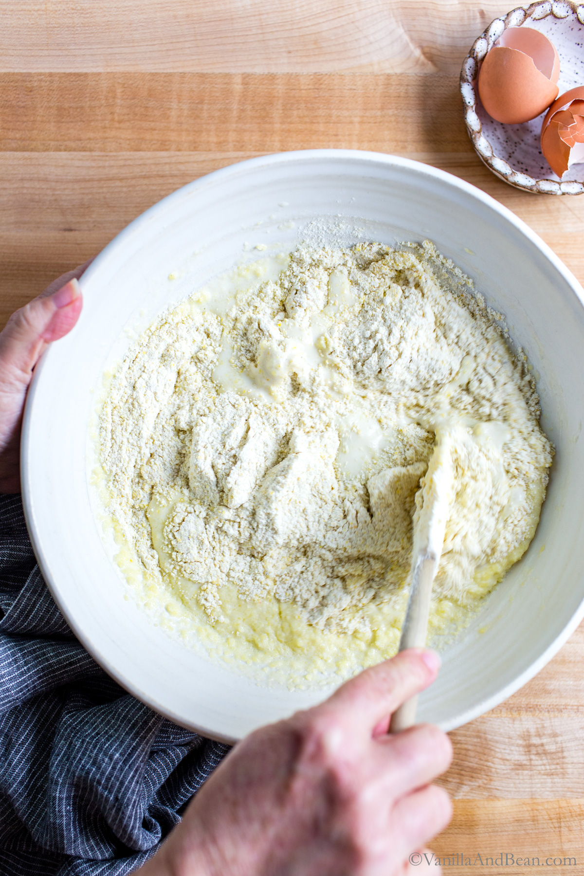 Mixing the wet and dry sourdough cornbread ingredients.