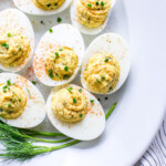 Dill Pickle Deviled Eggs on a serving platter.