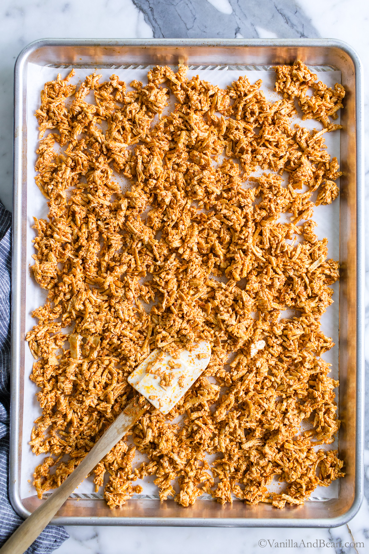 Unbaked Tex Mex Shredded Tofu on a sheet pan.