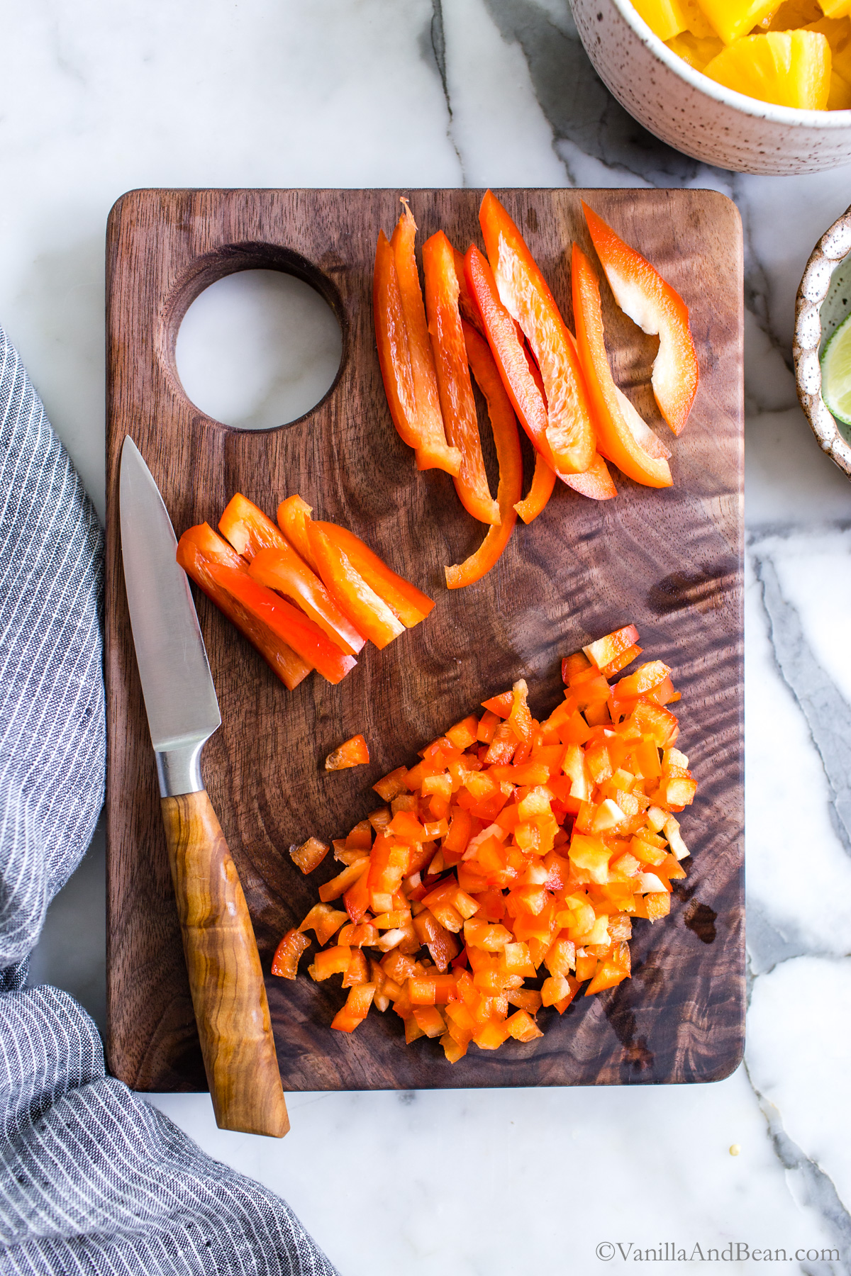 Red Bell Pepper, diced on a cutting board.
