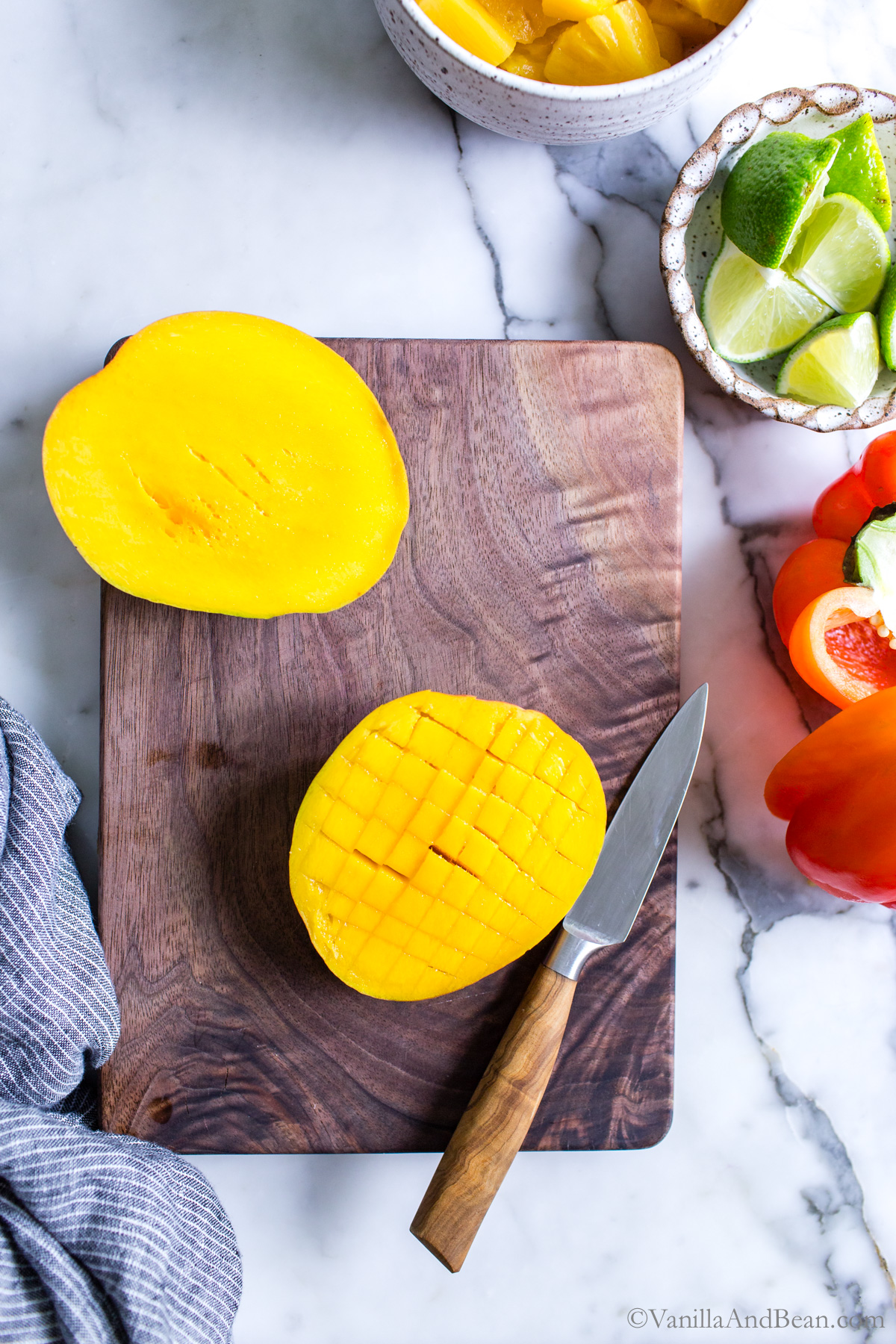 Sliced mango on a cutting board.