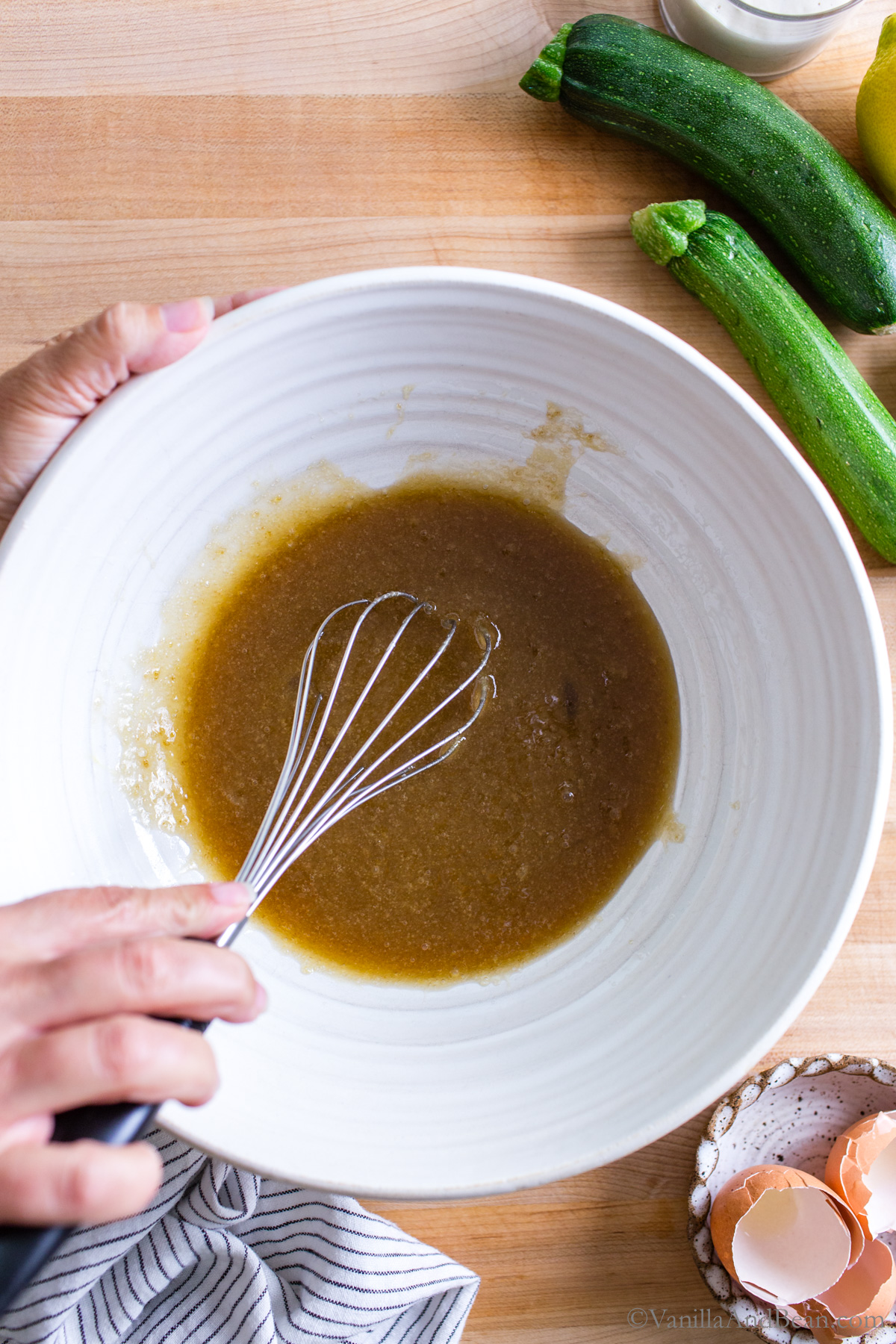 Mixing the wet ingredients in a bowl.