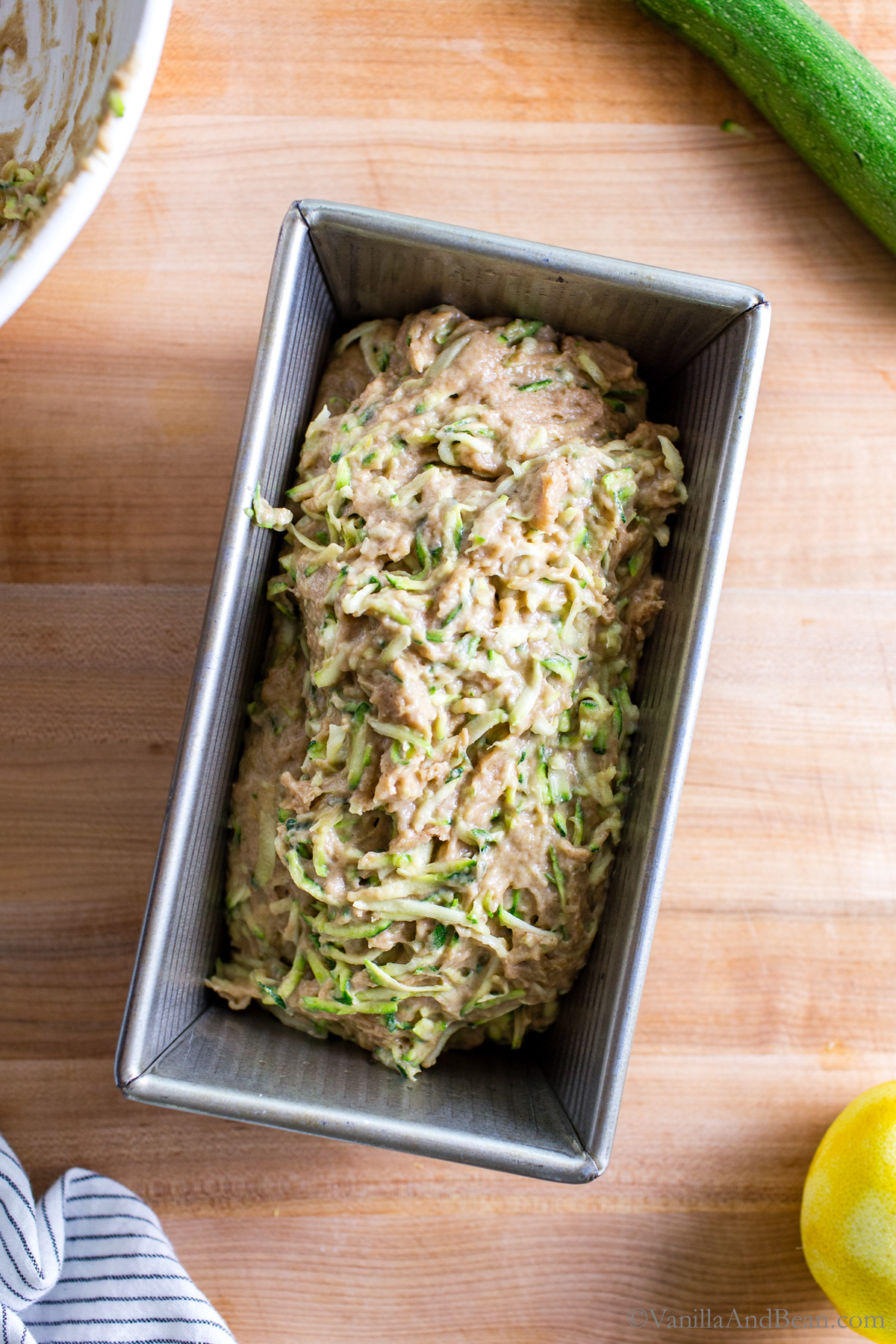 Zucchini batter in a loaf pan.