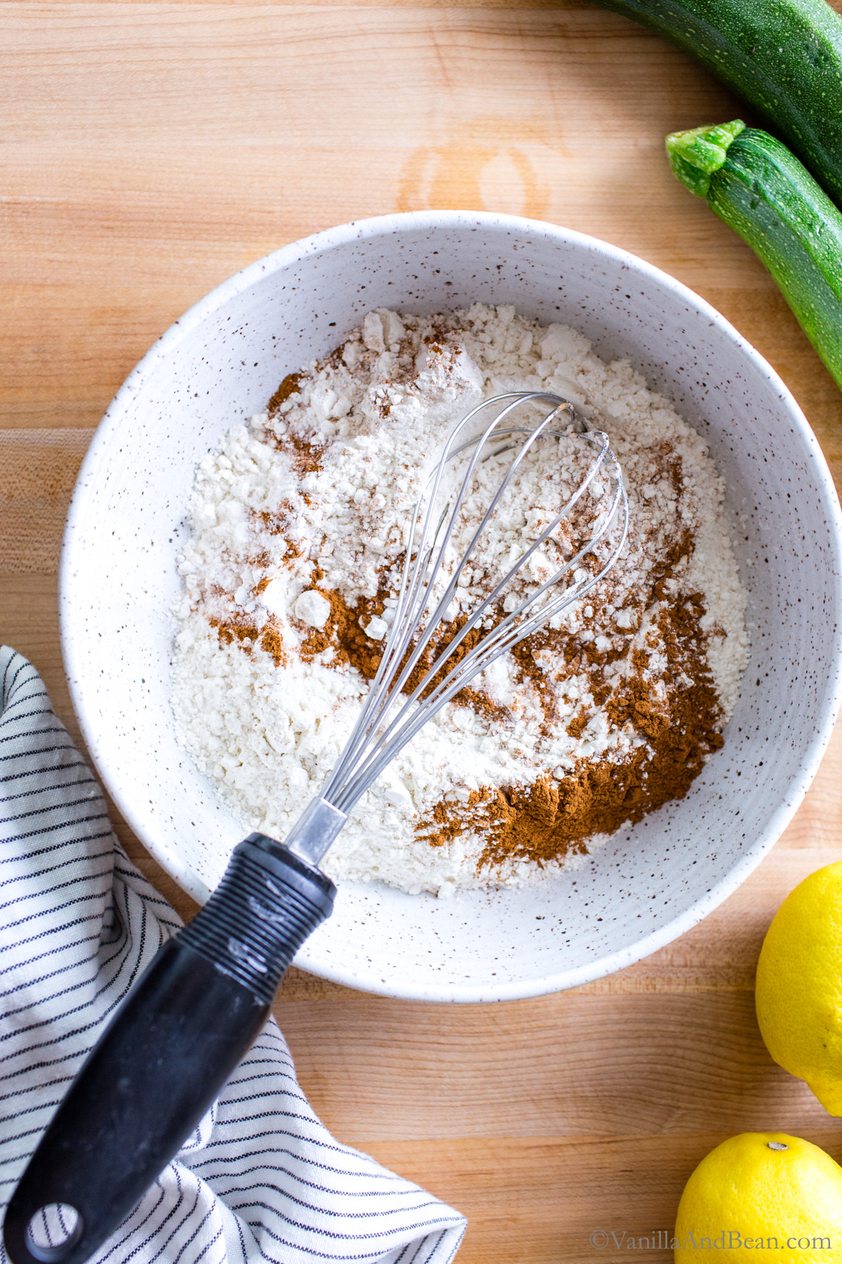Mixing the dry ingredients for sourdough discard zucchini bread.