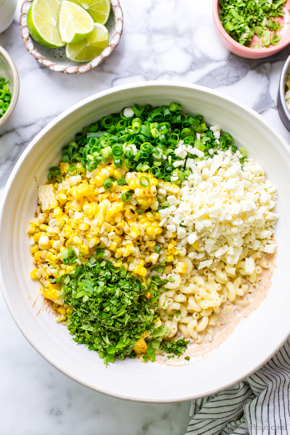 Mexican street corn pasta salad in a bowl un mixed.