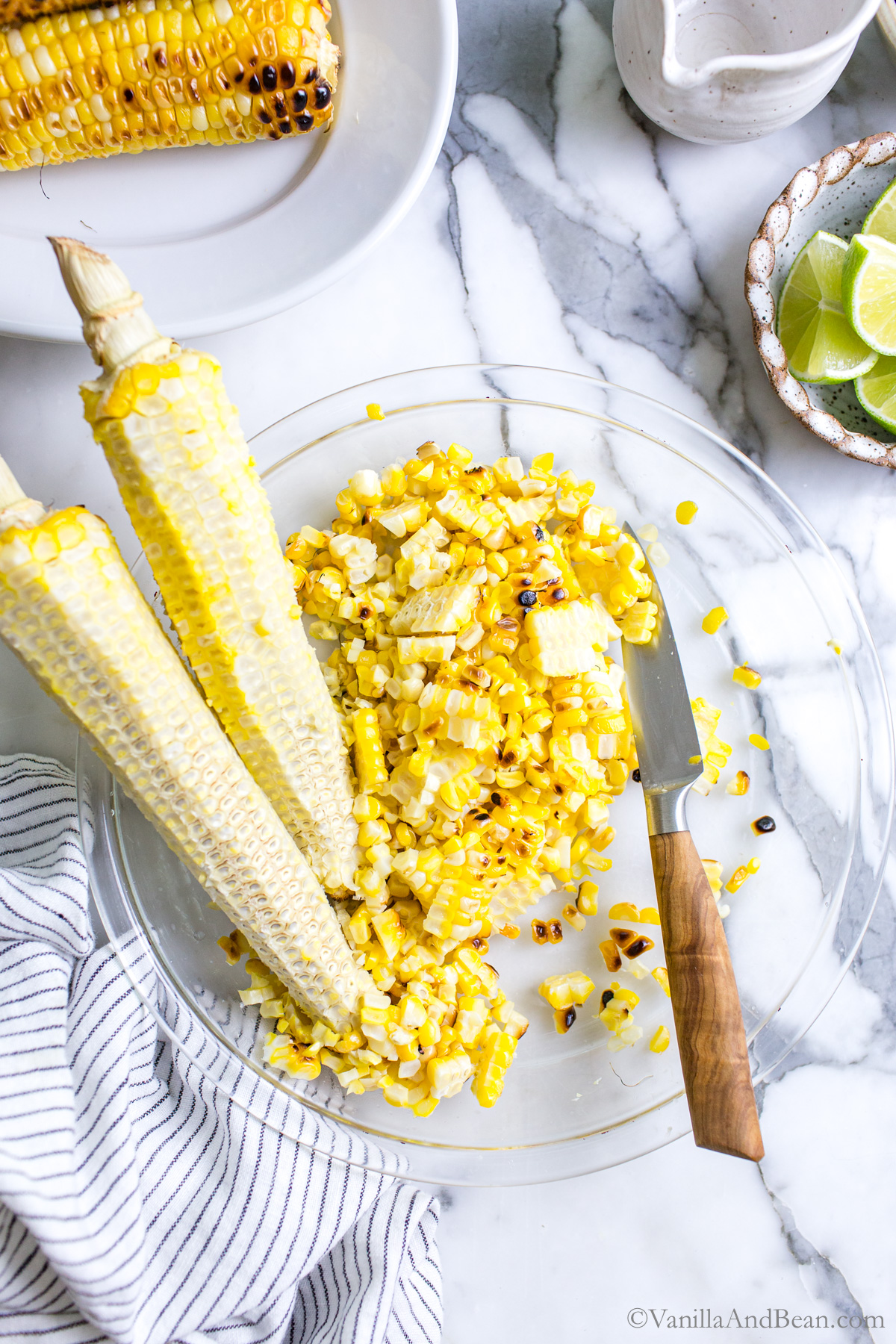 Corn on the cob cut off the cob in a pie plate.