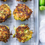 Zucchini Feta fritters on a cooling rack.