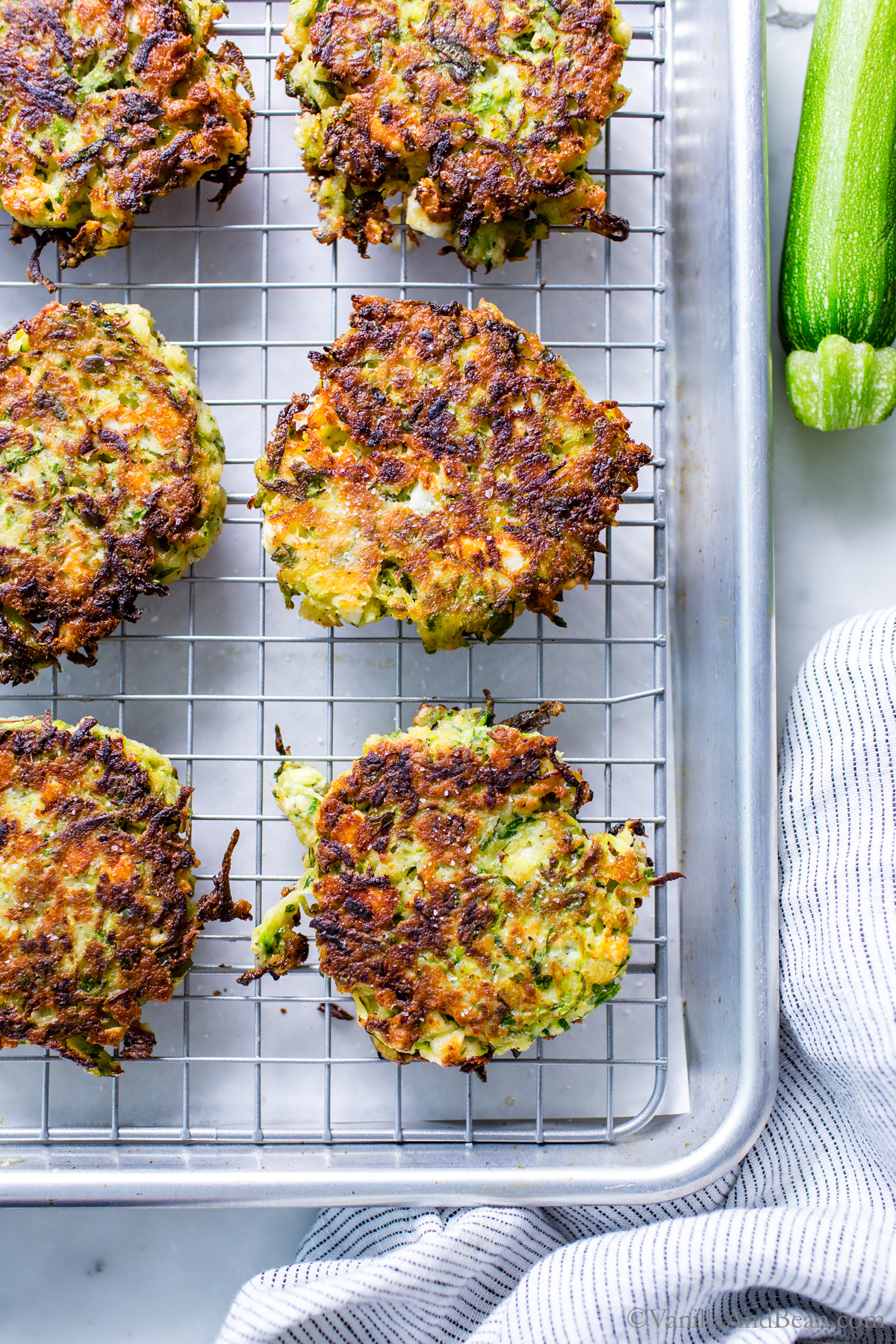 Zucchini Feta fritters on a cooling rack.
